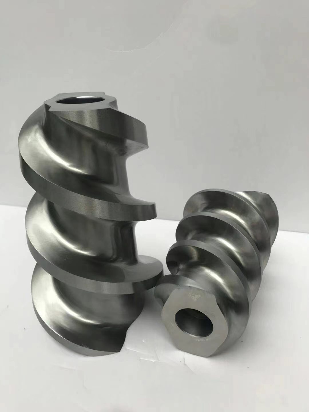 Helical conveying screw elements for a co-rotating twin-screw extruder